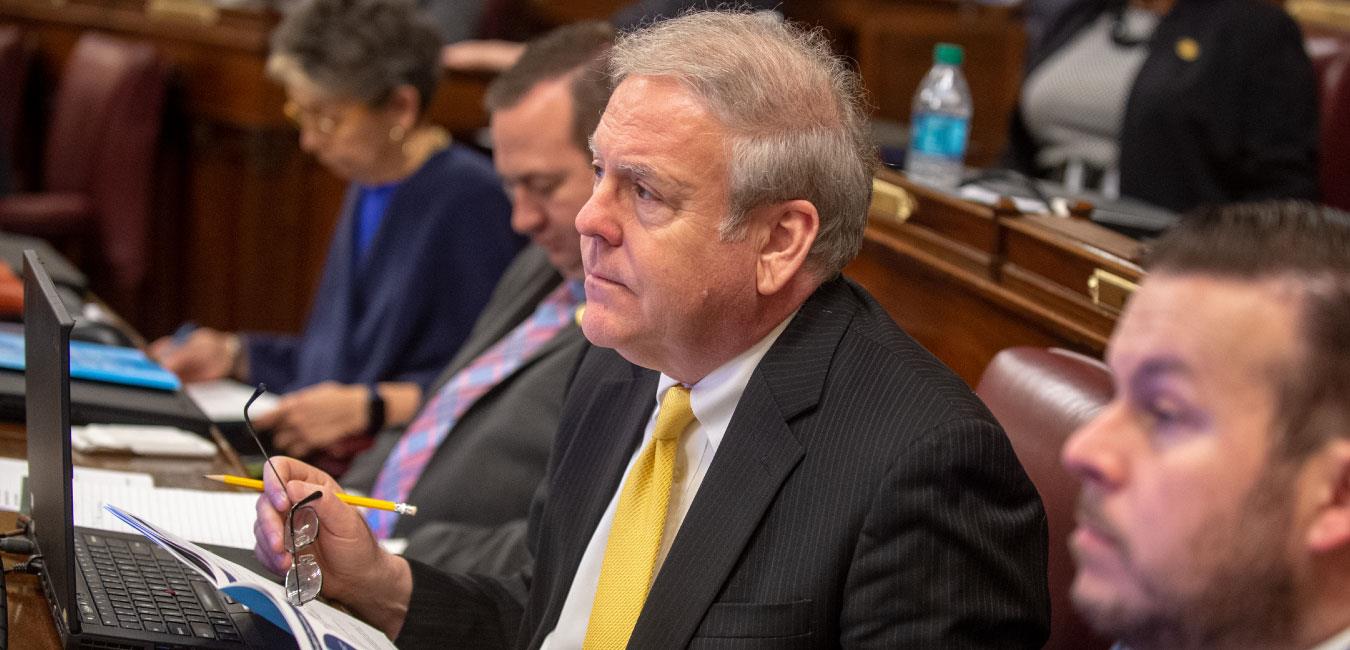 Representative Freeman looking forward from his seat on the House floor